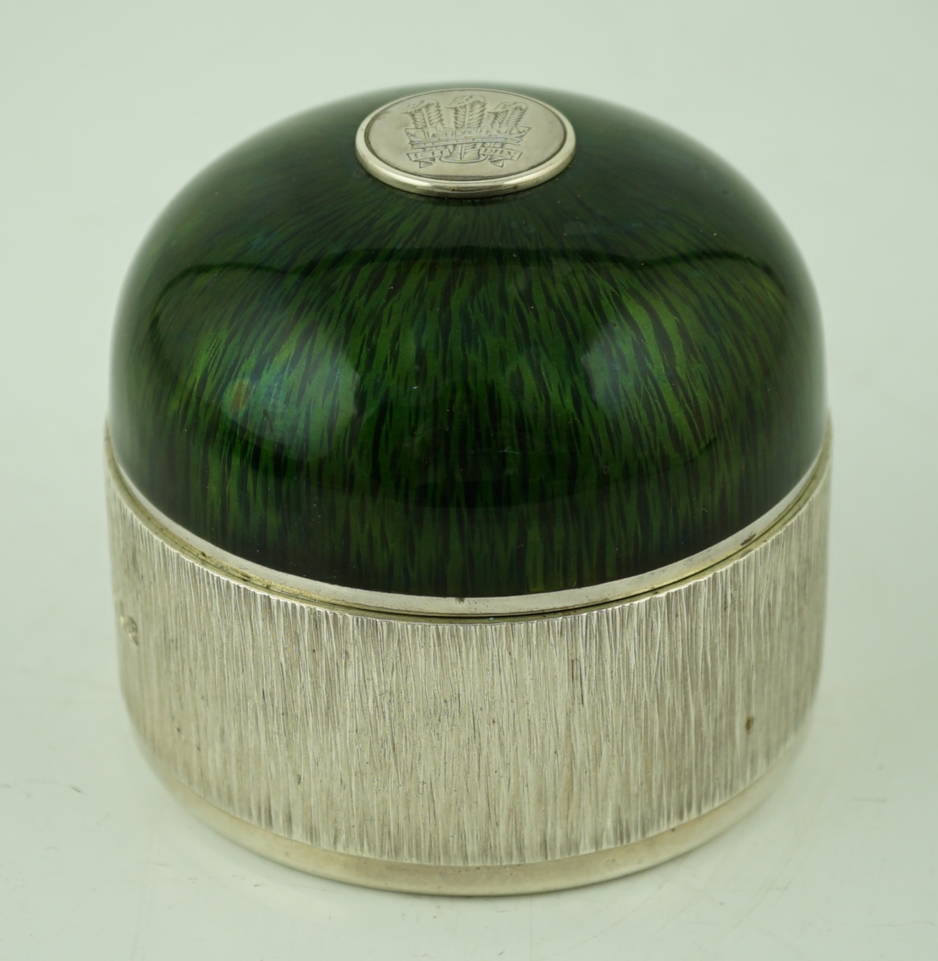 An Elizabeth II textured silver and green enamelled circular box and cover by Adrian Gerald Benney